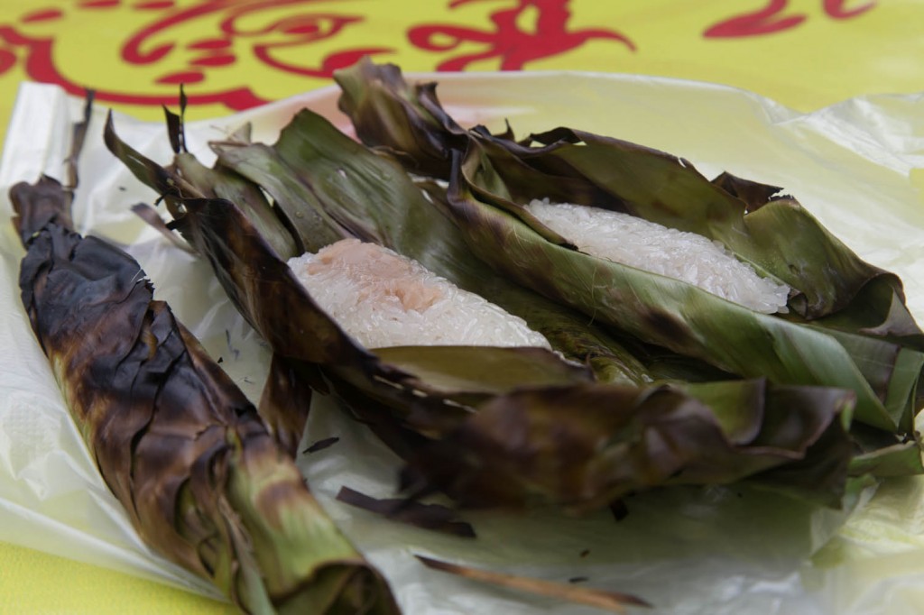 Sticky rice with taro and bamboo in charred banana leaf