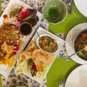 Hot and sour soup, roast green chilli relish, and various salads from Na Aroon in Bangkok