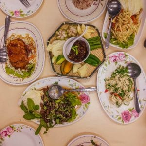 Table full of food at Sutunthip vegan restaurant in Bangkok